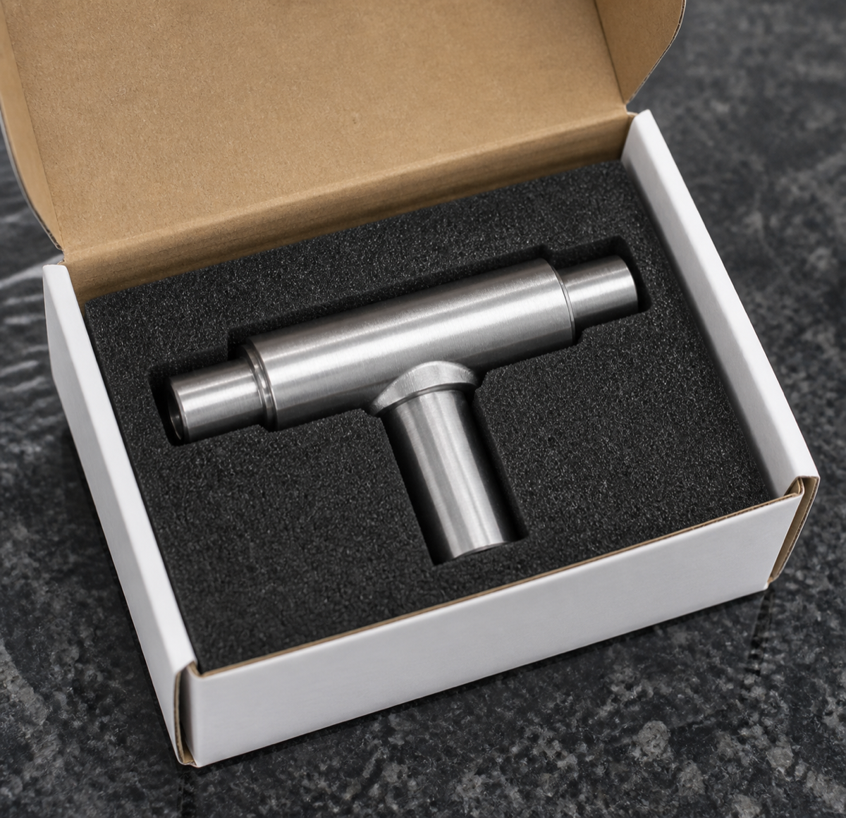 Embalaje protegido para eje cruciforme mecanizado de precision