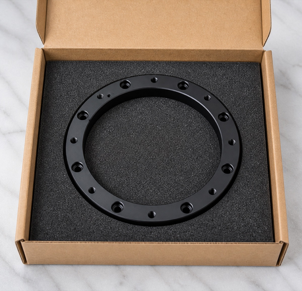 Embalaje individual de espuma para un anillo fijo robótico de primer eje anodizado negro